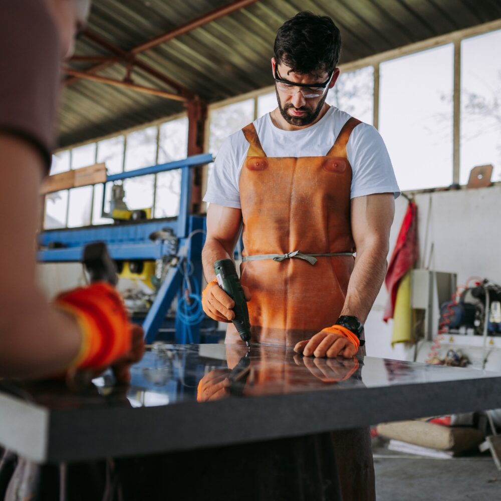 Man cutting a rock